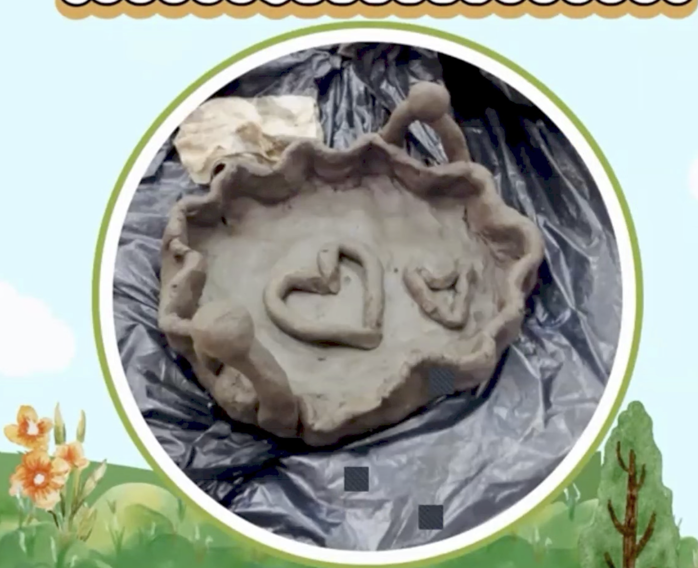 A clay bowl with a heart shaped into it